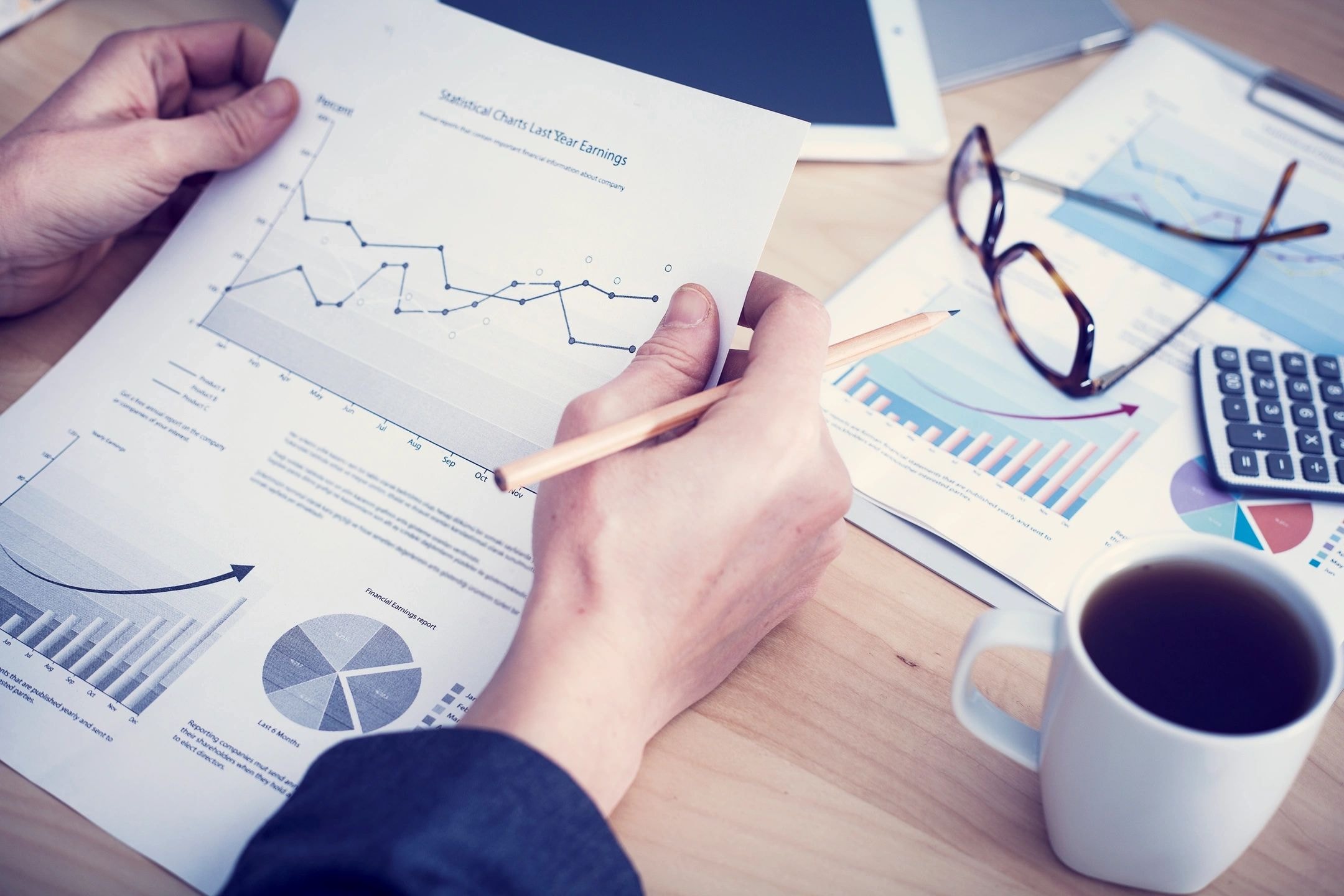 Business analyst reviewing statistical charts